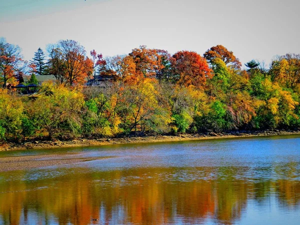 Colorful Autumn Trees Reflections On The River In New Jersey