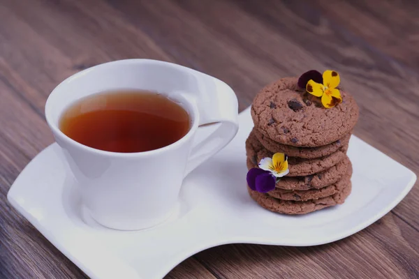 Cup Tea Stack Chocolate Cookies Flowers — Stock Photo, Image