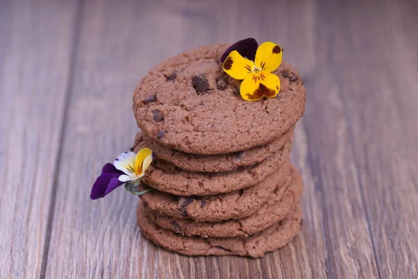 stack of chocolate cookies with flowers