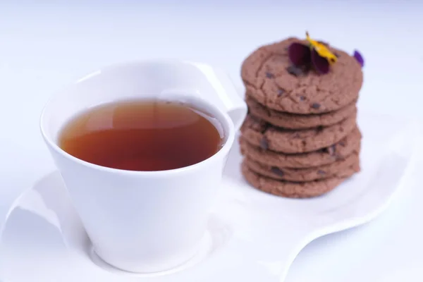 Cup Tea Stack Chocolate Cookies Flowers — Stock Photo, Image