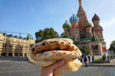 Street food. Neapolitan pizza on the background of Moscow. Moscow, Russia, October 2020. clipart