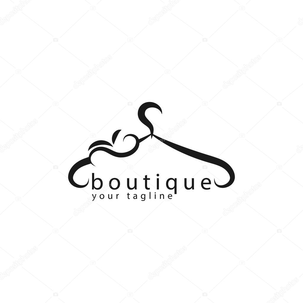 Creative Boutique logo design. Vector sign with lettering and hanger symbol. Logotype calligraphy