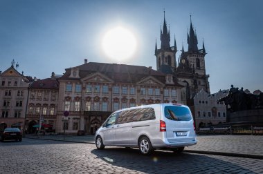 Prague, Czech Republic, 27.6.2019: Mercedes Benz V-class parks in front of building in centre of Prague. Luxury Mercedes on the road. clipart