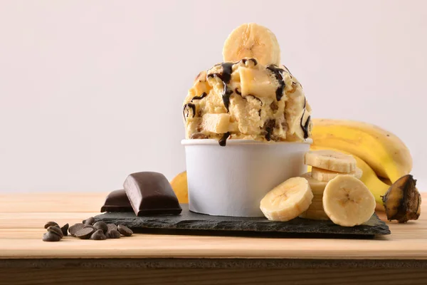 Banana ice cream cup decorated with chocolate