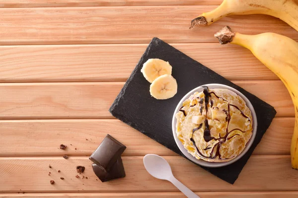 Banana ice cream cup decorated with chocolate top