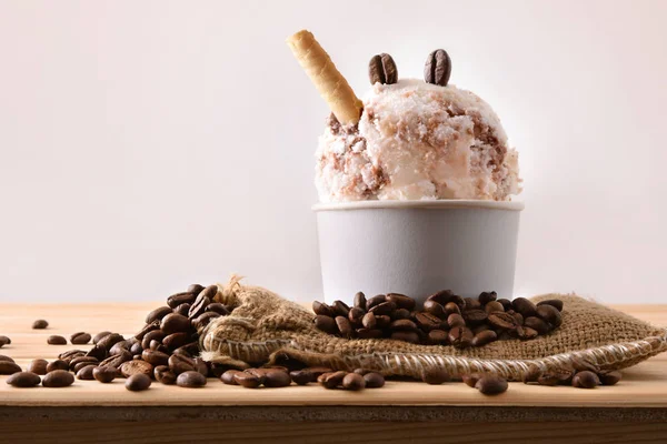 Coffee ice cream cup decorated with grains and waffle