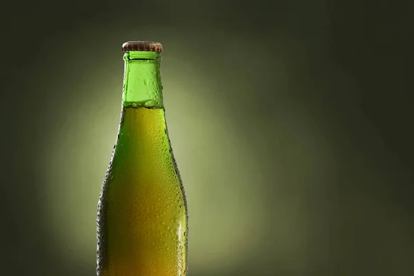 Bottle full of liquid with alcohol with green background detail — Stock Photo, Image