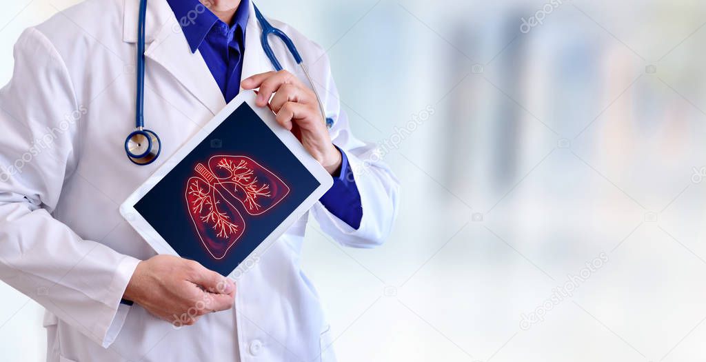 Doctor showing lungs on a tablet in hospital