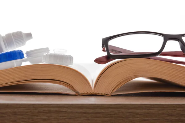 Different types of vision correction for reading books — Stock Photo, Image