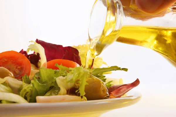 Pouring Olive Oil Oil Dispenser Prepared Salad White Plate Isolated Royalty Free Stock Photos