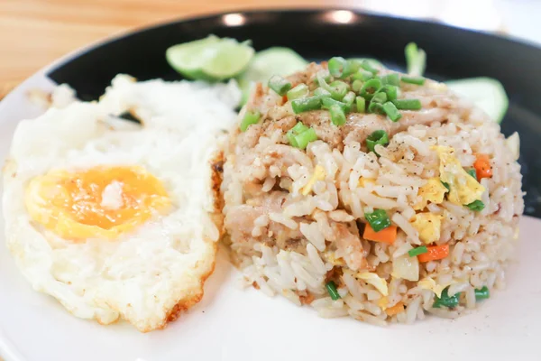 fried rice or stir-fried rice with pork and  fried egg