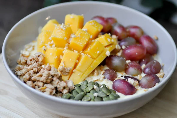 Smoothie bowl, mango yogurt with fruit topping — Stock Photo, Image