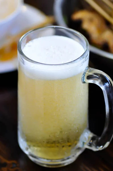 A glass of beer with beer foam — Stock Photo, Image