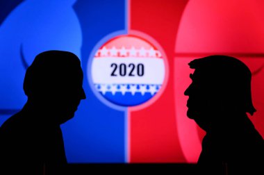 NEW YORK, USA, JUN 17, 2020: Silhouette of republican candidate Donald Trump and democratic candidate Joe Biden. 2020 United States presidential election. US vote, Concept photo for November 3, 2020 clipart