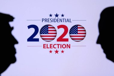 NEW YORK, USA, JUN 17, 2020: Silhouette of republican candidate Donald Trump and democratic candidate Joe Biden. 2020 United States presidential election. US vote, Concept photo for November 3, 2020 clipart