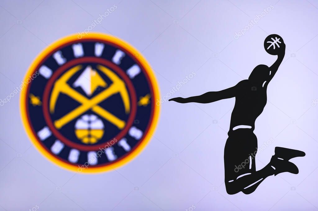 NEW YORK, USA, JUN 18, 2020: Denver Nuggets basketball club logo, silhouette of jumping basket player, sport photo NBA, edit space.