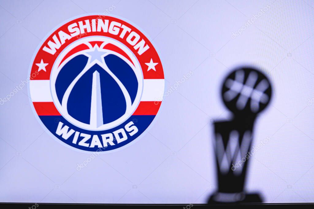 NEW YORK, USA, JUN 18, 2020: Washington Wizards Basketball club on the white screen. Silhouette of NBA trophy in foreground.
