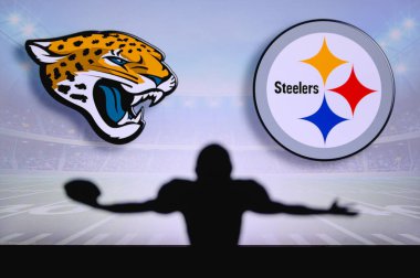 Jacksonville Jaguarları Pittsburgh Çelik 'e karşı. NFL oyunu. Amerikan Futbol Ligi maçı. Profesyonel oyuncunun silueti dokunuşu kutluyor. Arkaplanda ekran.