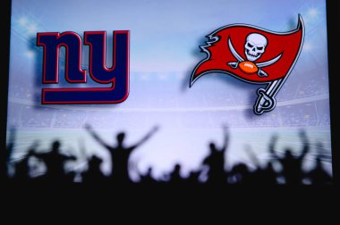 New York Giants vs. Tampa Bay Buccaneers. Fans support on NFL Game. Silhouette of supporters, big screen with two rivals in background. clipart