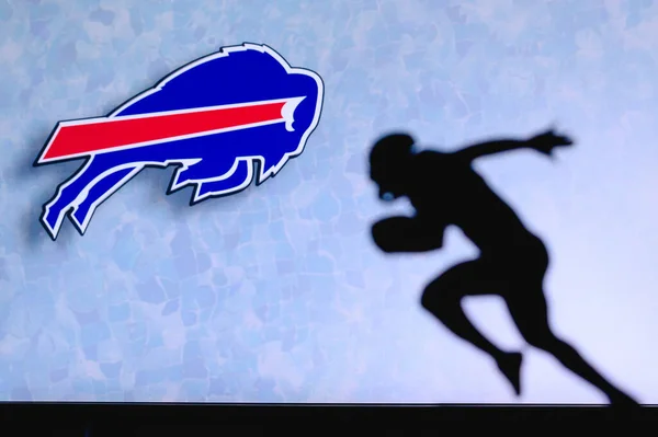 stock image Buffalo Bills. Silhouette of professional american football player. Logo of NFL club in background, edit space.