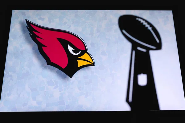 stock image Arizona Cardinals professional american football club, silhouette of NFL trophy, logo of the club in background.