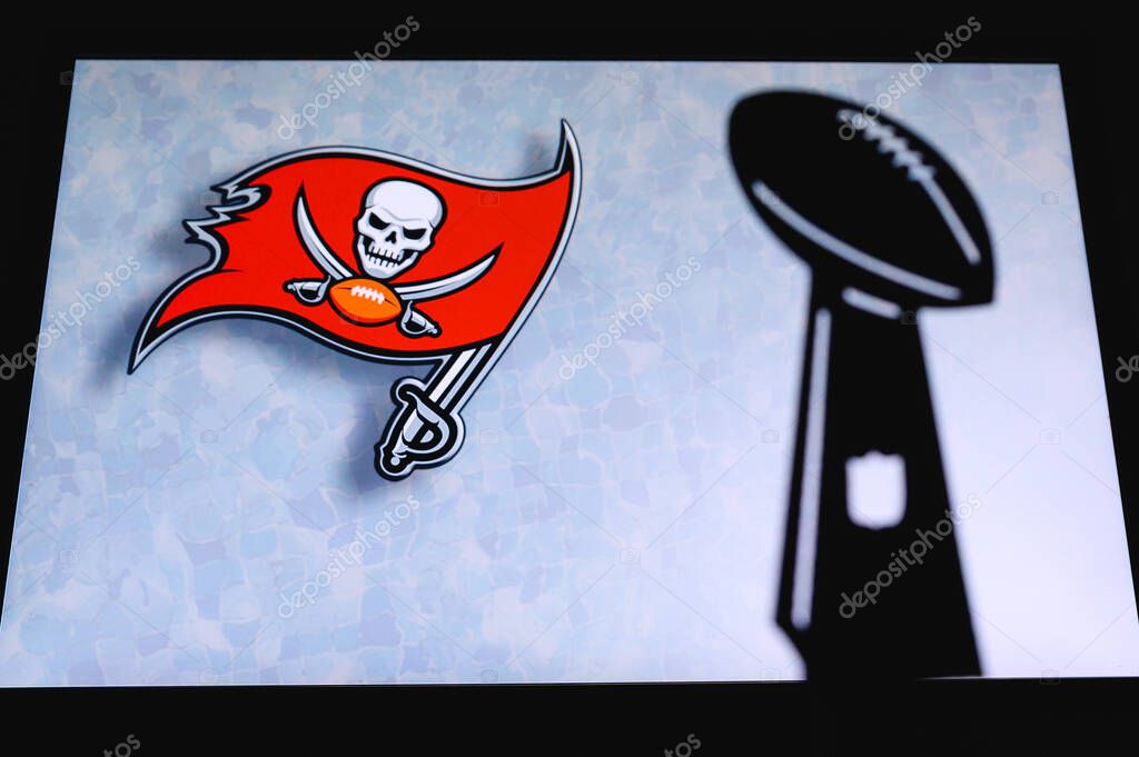 Tampa Bay Buccaneers professional american football club, silhouette of NFL trophy, logo of the club in background.