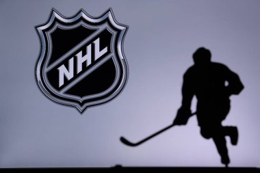 TORONTO, CANADA, 17. JULY: National Hockey League Concept photo. silhouette of profesiional NHL hockey player clipart