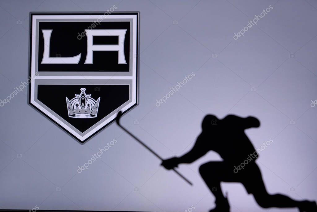 TORONTO, CANADA, 17. JULY: Los Angeles Kings Logo. Professional NHL hockey player celebrate goal. Silhouette photo, Edit space