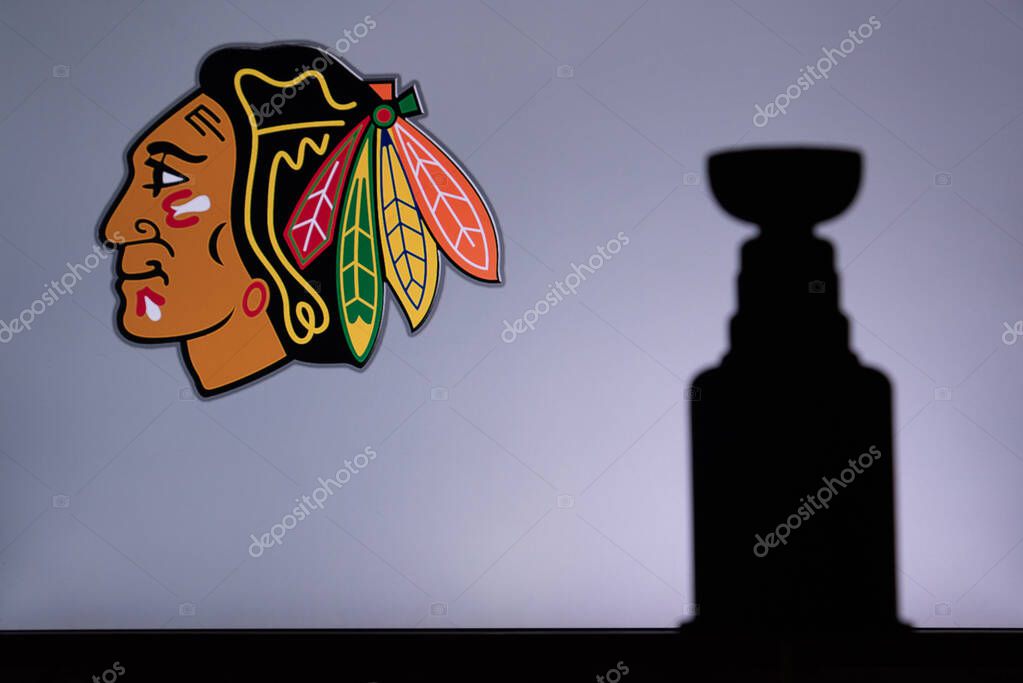 TORONTO, CANADA, 17. JULY: Chicago BlackhawksLogo of NHL club on the screen. Stenley Cup Trophy Silhouette.