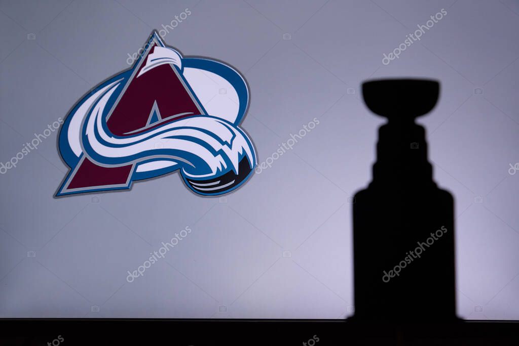 TORONTO, CANADA, 17. JULY: Colorado AvalancheLogo of NHL club on the screen. Stenley Cup Trophy Silhouette.