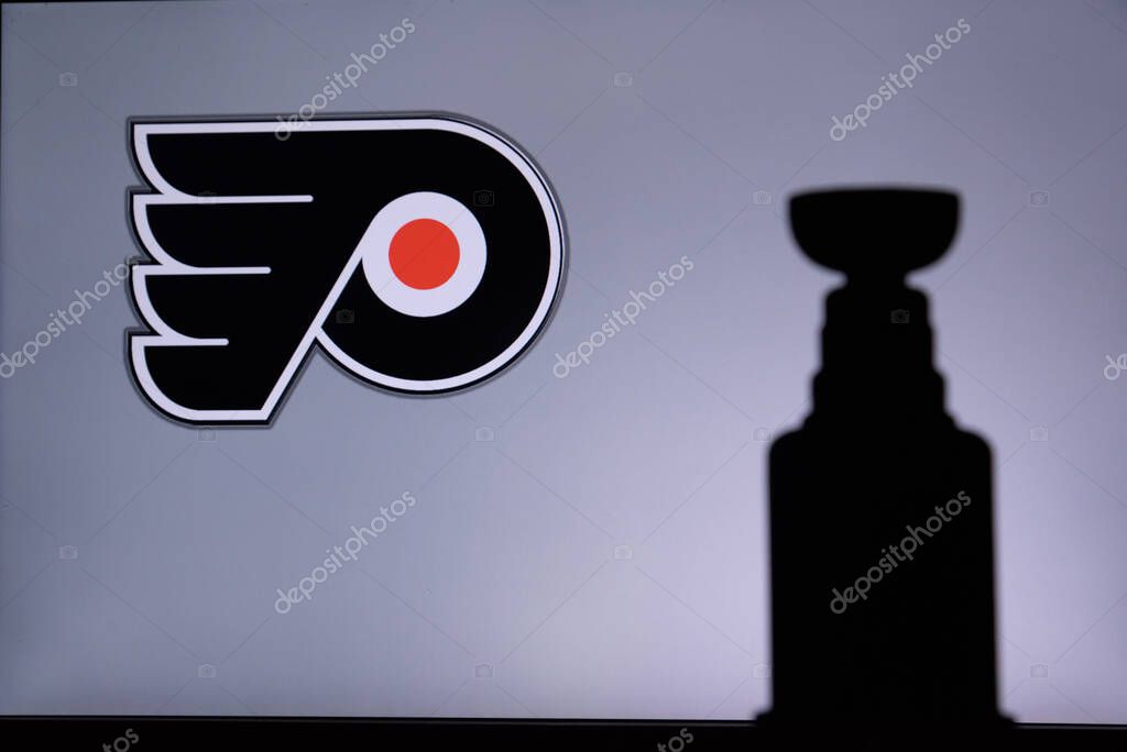 TORONTO, CANADA, 17. JULY: Philadelphia FlyersLogo of NHL club on the screen. Stenley Cup Trophy Silhouette.