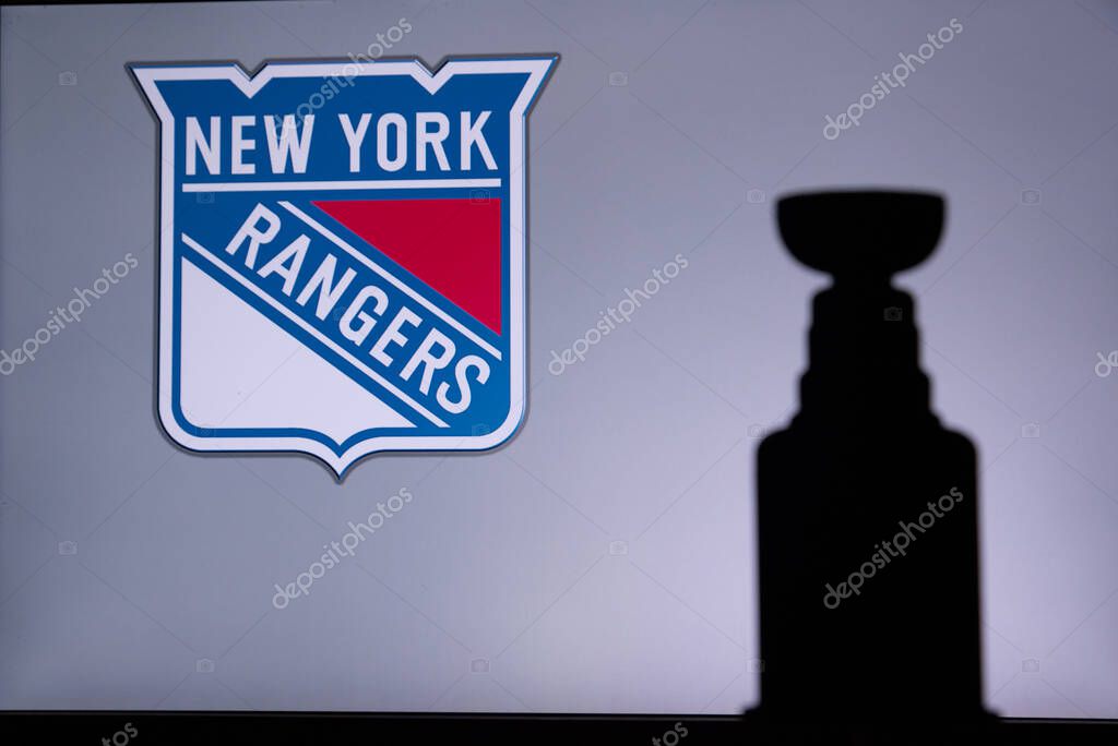 TORONTO, CANADA, 17. JULY: New York RangersLogo of NHL club on the screen. Stenley Cup Trophy Silhouette.