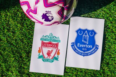 VIENNA, AUSTRIA, MAY 26, 2025: Liverpool vs Everton derby football match in Premier League. Club logo and official ball on green soccer grass. Merseyside Derby.