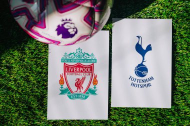 VIENNA, AUSTRIA, MAY 26, 2025: Liverpool vs Tottenham Hotspur derby football match in Premier League. Club logo and official ball on green soccer grass.
