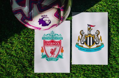 VIENNA, AUSTRIA, MAY 26, 2025: Liverpool vs Newcastle United derby football match in Premier League. Club logo and official ball on green soccer grass.