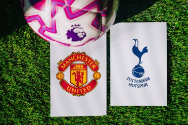 VIENNA, AUSTRIA, MAY 26, 2025: Manchester United vs Tottenham Hotspur derby football match in Premier League. Club logo and official ball on green soccer grass.