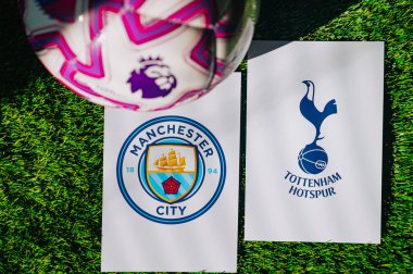 VIENNA, AUSTRIA, MAY 26, 2025: Manchester City vs Tottenham Hotspur derby football match in Premier League. Club logo and official ball on green soccer grass.