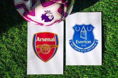 VIENNA, AUSTRIA, MAY 26, 2025: Arsenal vs Everton derby football match in Premier League. Club logo and official ball on green soccer grass.