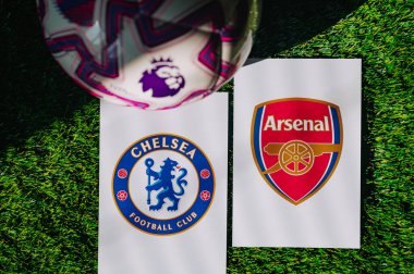 VIENNA, AUSTRIA, MAY 26, 2025: Chelsea vs Arsenal derby football match in Premier League. Club logo and official ball on green soccer grass.