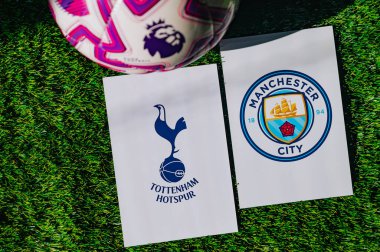VIENNA, AUSTRIA, MAY 26, 2025: Tottenham Hotspur vs Manchester City derby football match in Premier League. Club logo and official ball on green soccer grass.
