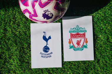 VIENNA, AUSTRIA, MAY 26, 2025: Tottenham Hotspur vs Liverpool derby football match in Premier League. Club logo and official ball on green soccer grass.