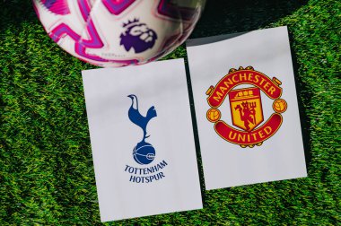 VIENNA, AUSTRIA, MAY 26, 2025: Tottenham Hotspur vs Manchester United derby football match in Premier League. Club logo and official ball on green soccer grass.
