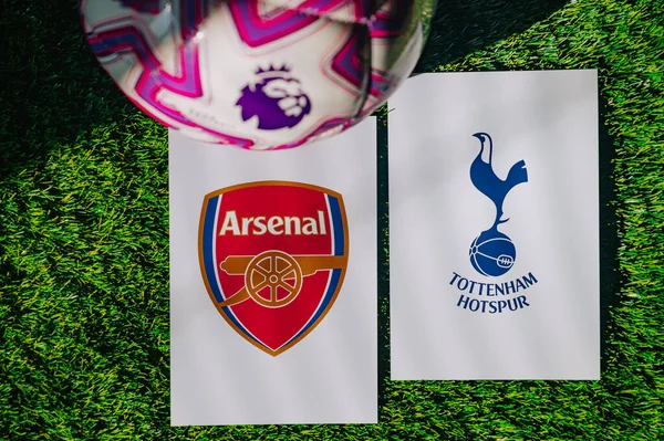 VIENNA, AUSTRIA, MAY 26, 2025: Arsenal vs Tottenham Hotspur derby football match in Premier League. Club logo and official ball on green soccer grass.