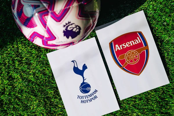 VIENNA, AUSTRIA, MAY 26, 2025: Tottenham Hotspur vs Arsenal derby football match in Premier League. Club logo and official ball on green soccer grass.