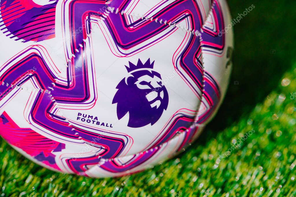 VIENNA, AUSTRIA, MAY 26, 2025: Official Premier League Ball for the 2025/2026 season, sponsored by Puma, placed on green grass. Detail at Premier League Logo