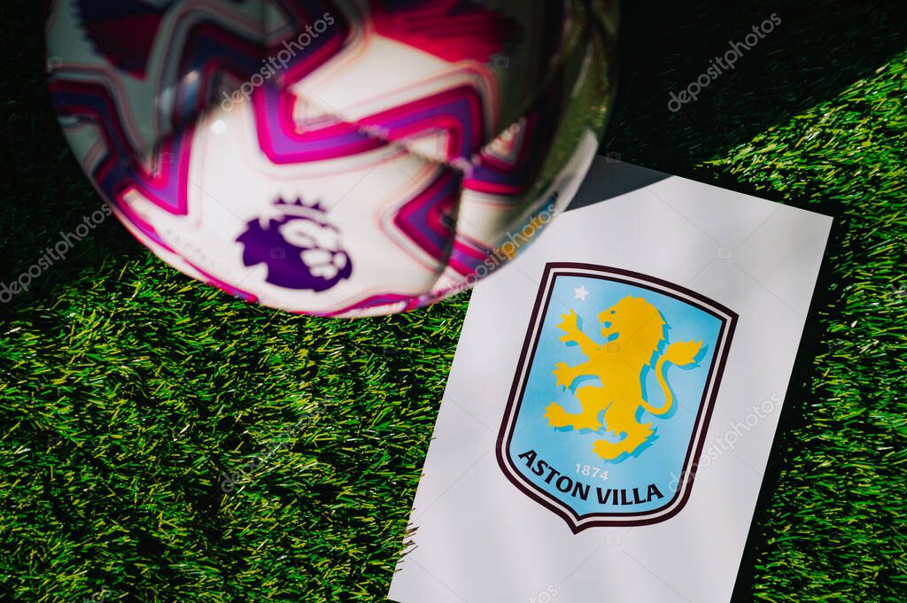 VIENNA, AUSTRIA, MAY 26, 2025: Aston Villa logo of football club of Premier League. Official ball for season 2025 and 2026. And logo of soccer club in major British league on green grass