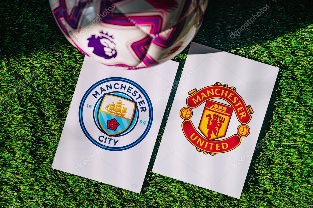 VIENNA, AUSTRIA, MAY 26, 2025: Manchester City vs Manchester United derby football match in Premier League. Club logo and official ball on green soccer grass. Manchester Derby