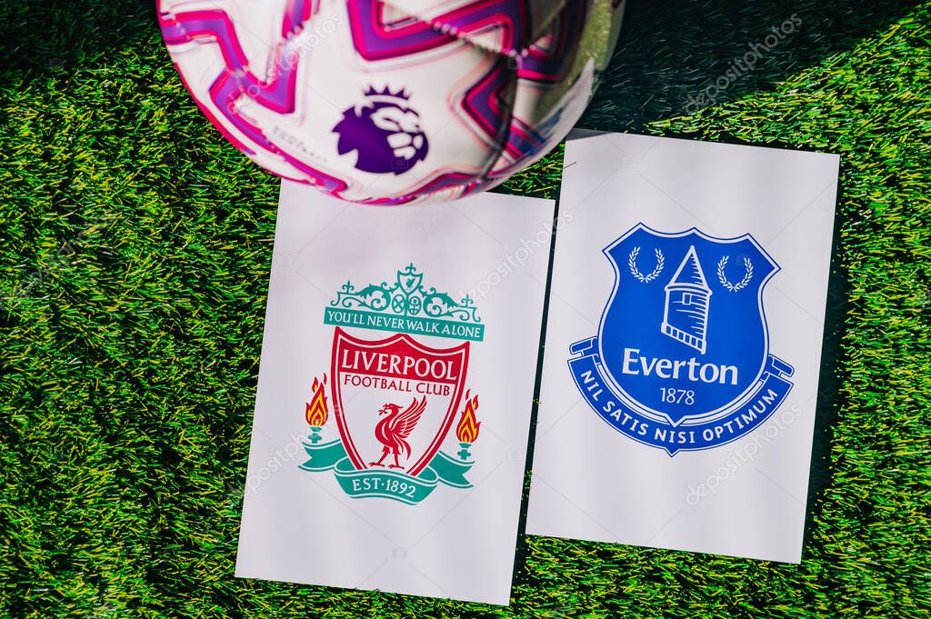 VIENNA, AUSTRIA, MAY 26, 2025: Liverpool vs Everton derby football match in Premier League. Club logo and official ball on green soccer grass. Merseyside Derby.