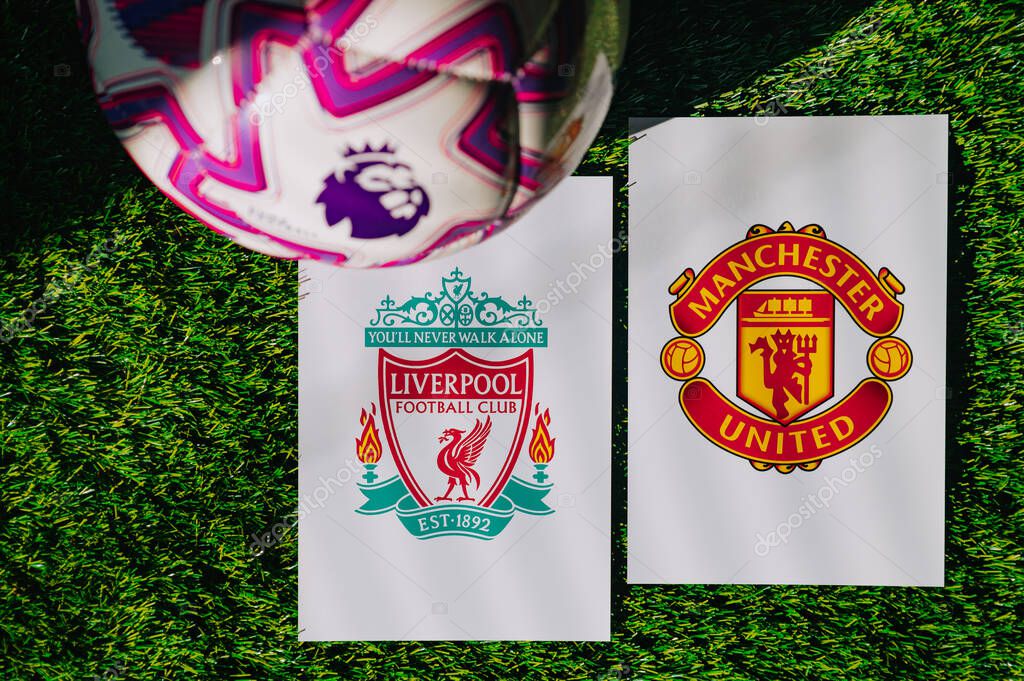 VIENNA, AUSTRIA, MAY 26, 2025: Liverpool vs Manchester United derby football match in Premier League. Club logo and official ball on green soccer grass. Northwest Derby
