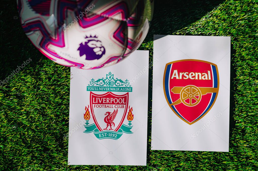 VIENNA, AUSTRIA, MAY 26, 2025: Liverpool vs Arsenal derby football match in Premier League. Club logo and official ball on green soccer grass.